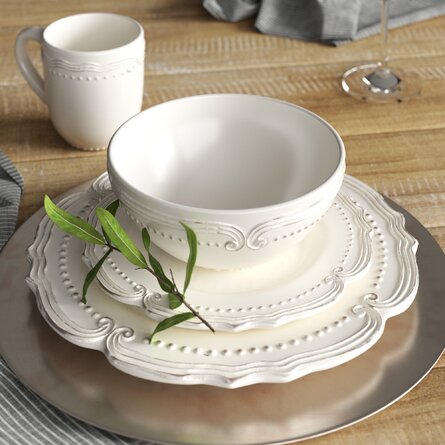 white victorian dinnerware set  on wood table