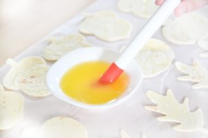 melted butter in a small bowl and brush with uncooked tortilla cutouts