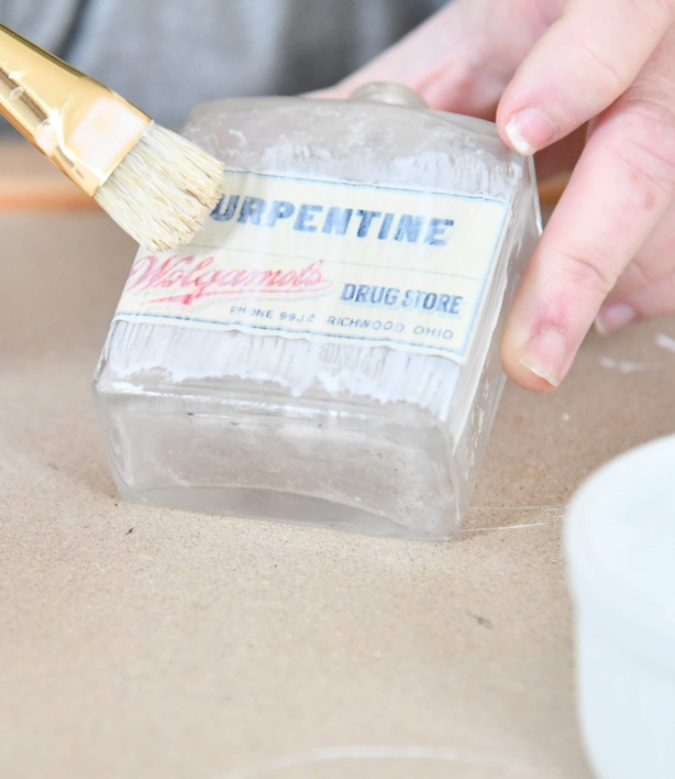 Use Paint Brush to add Modge Podge to Bottle