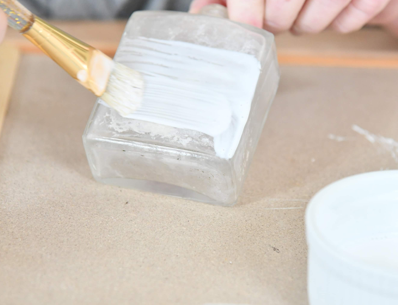 Use paintbrush to add Modge Podge to bottle