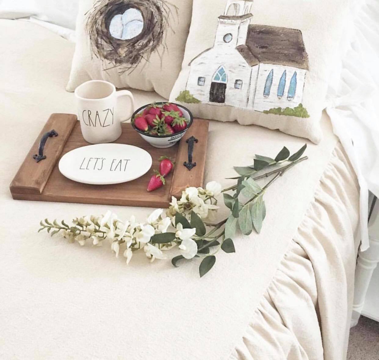 Farmhouse bedding with ruffle. Painted bird and nest pillows tray with plate and strawberry's