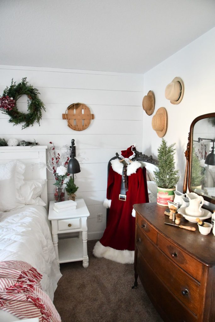 Mrs. Clause Vintage Santa Dress hanging on Large Mirror in bedroom for christmas