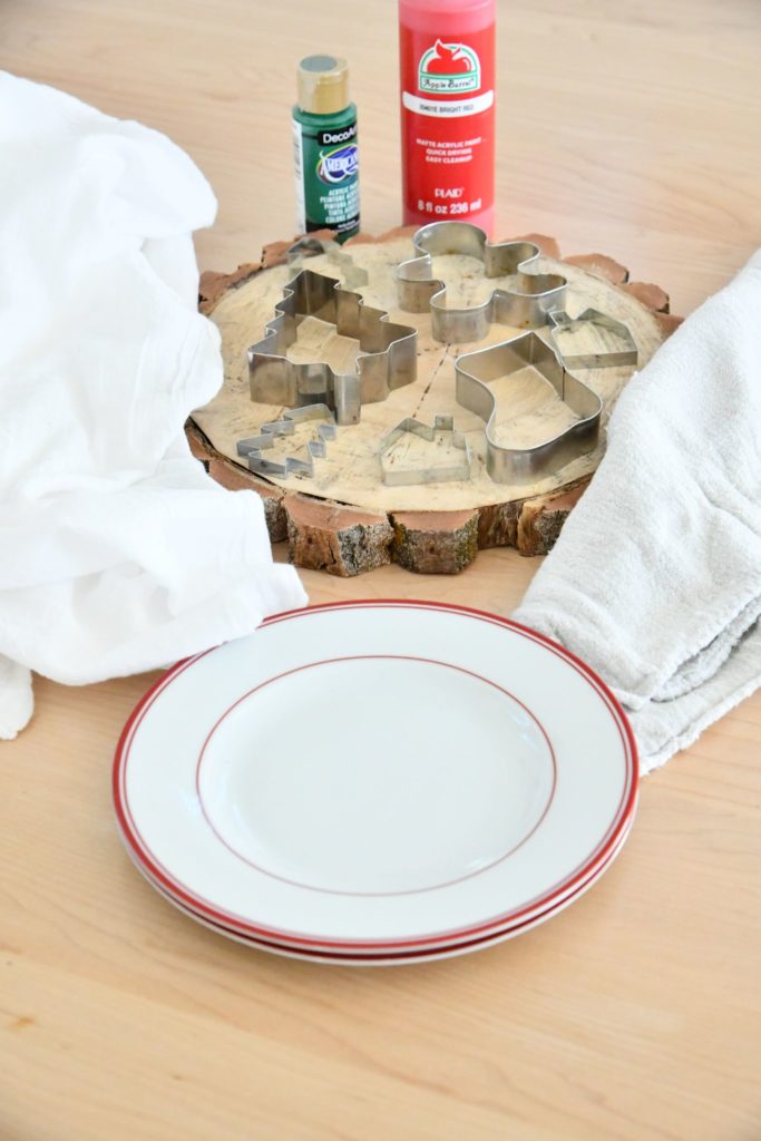 DIY Tea Towel Gift Materials on table; cookie cutters, paint, tea towels
