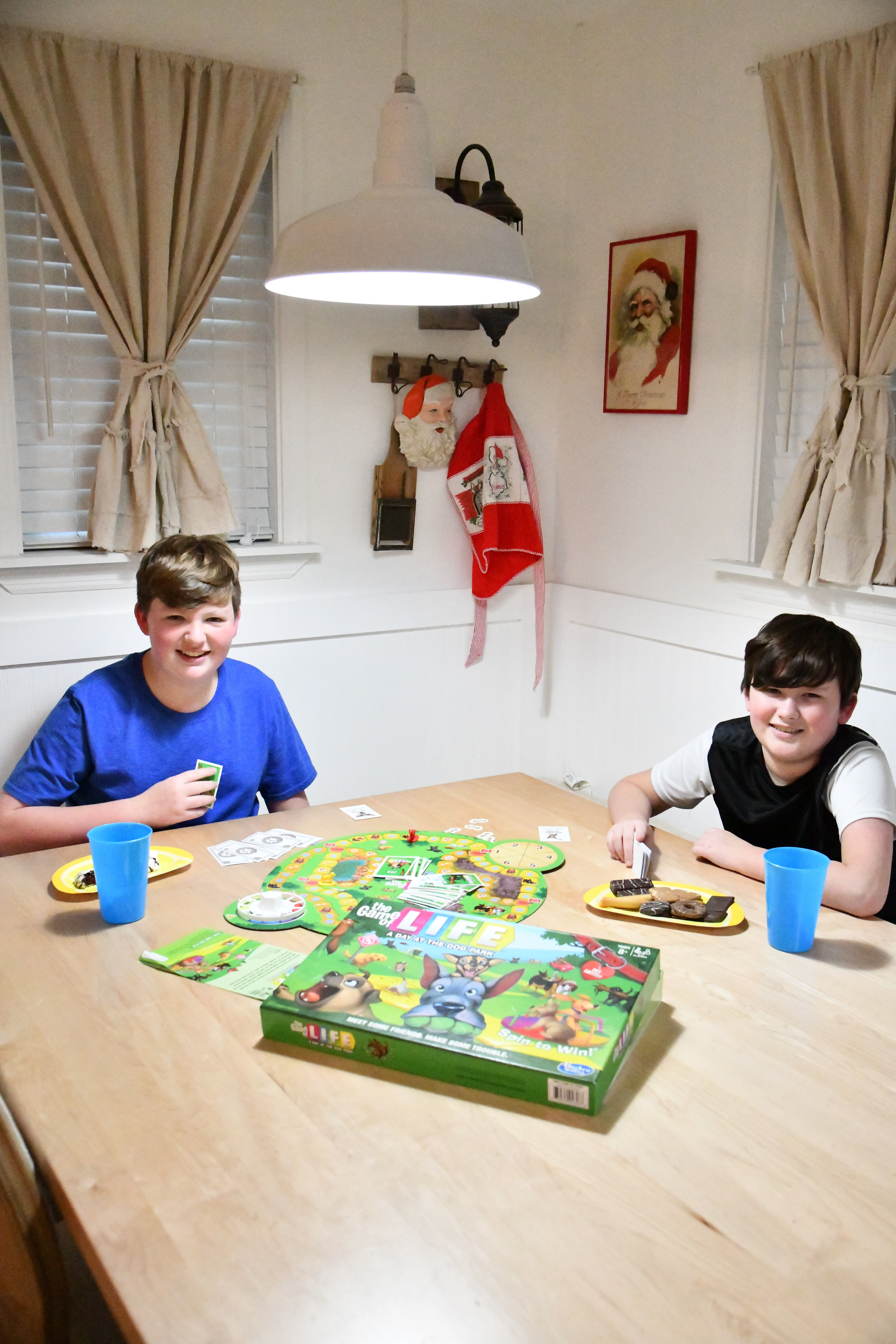 Brothers at table for family game night with Hasbro