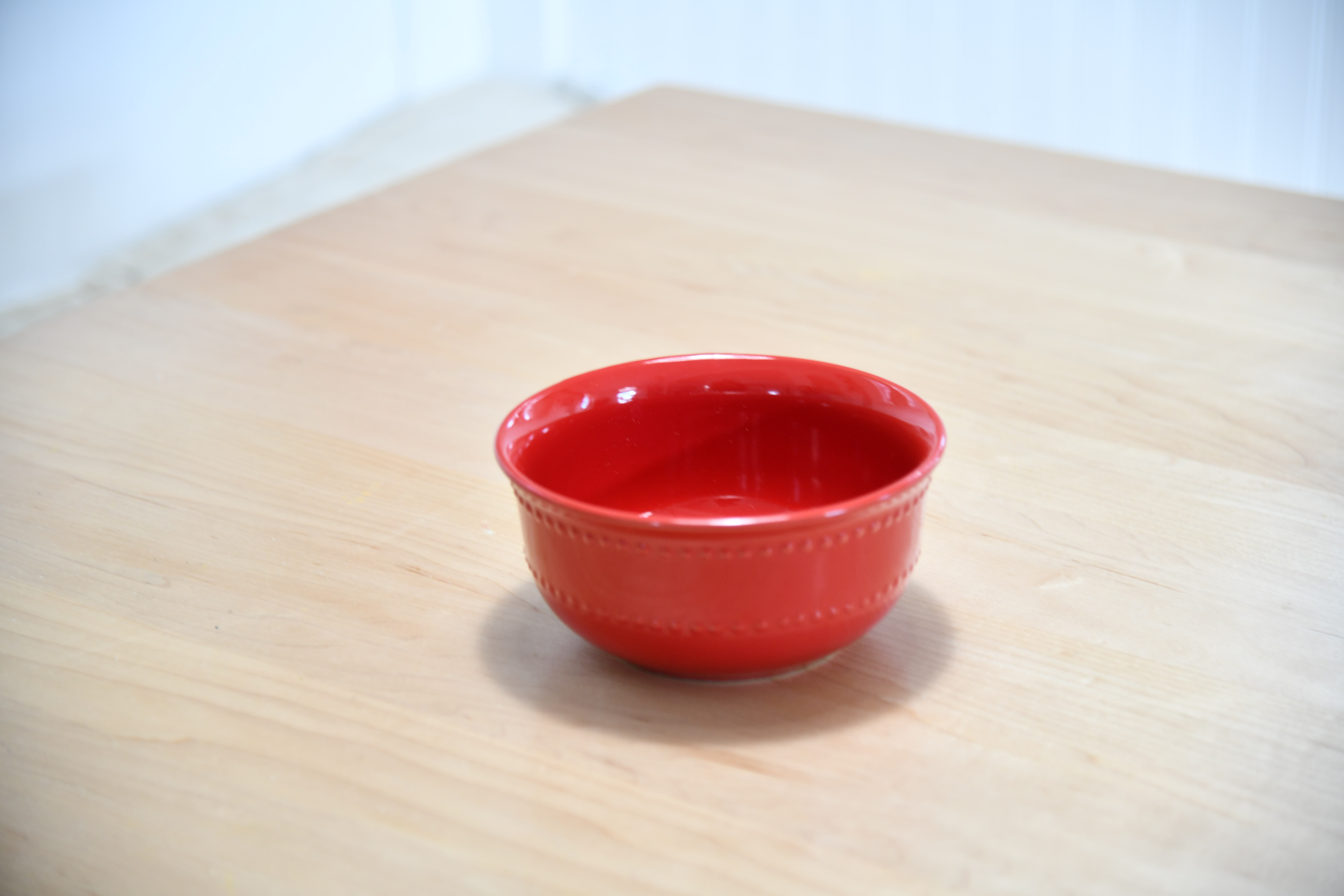 Red Bowl on Table for Dollar Store DIY Cake Stand