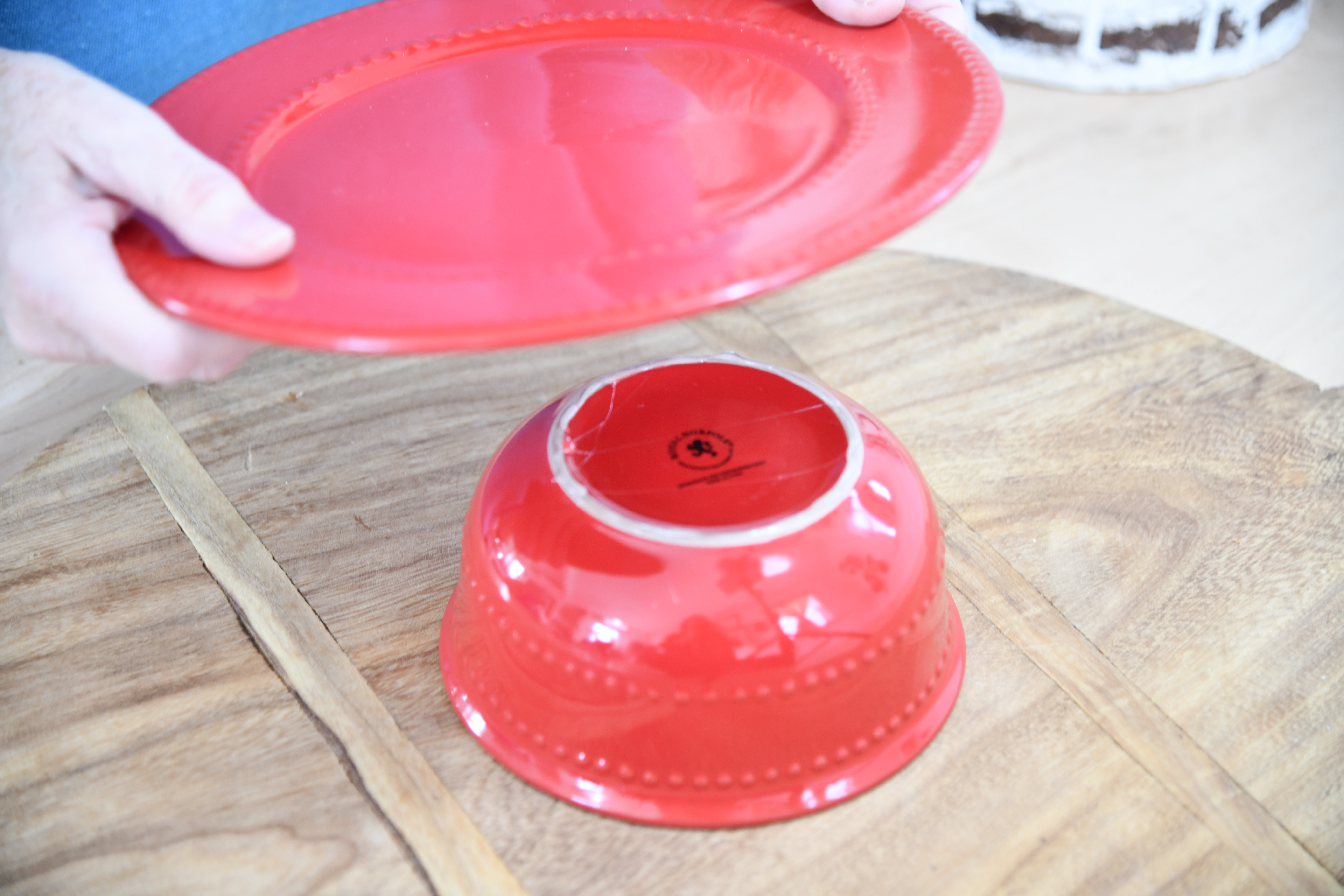 Place Red Plate on top of upside down bowl with glue on ring of bowl