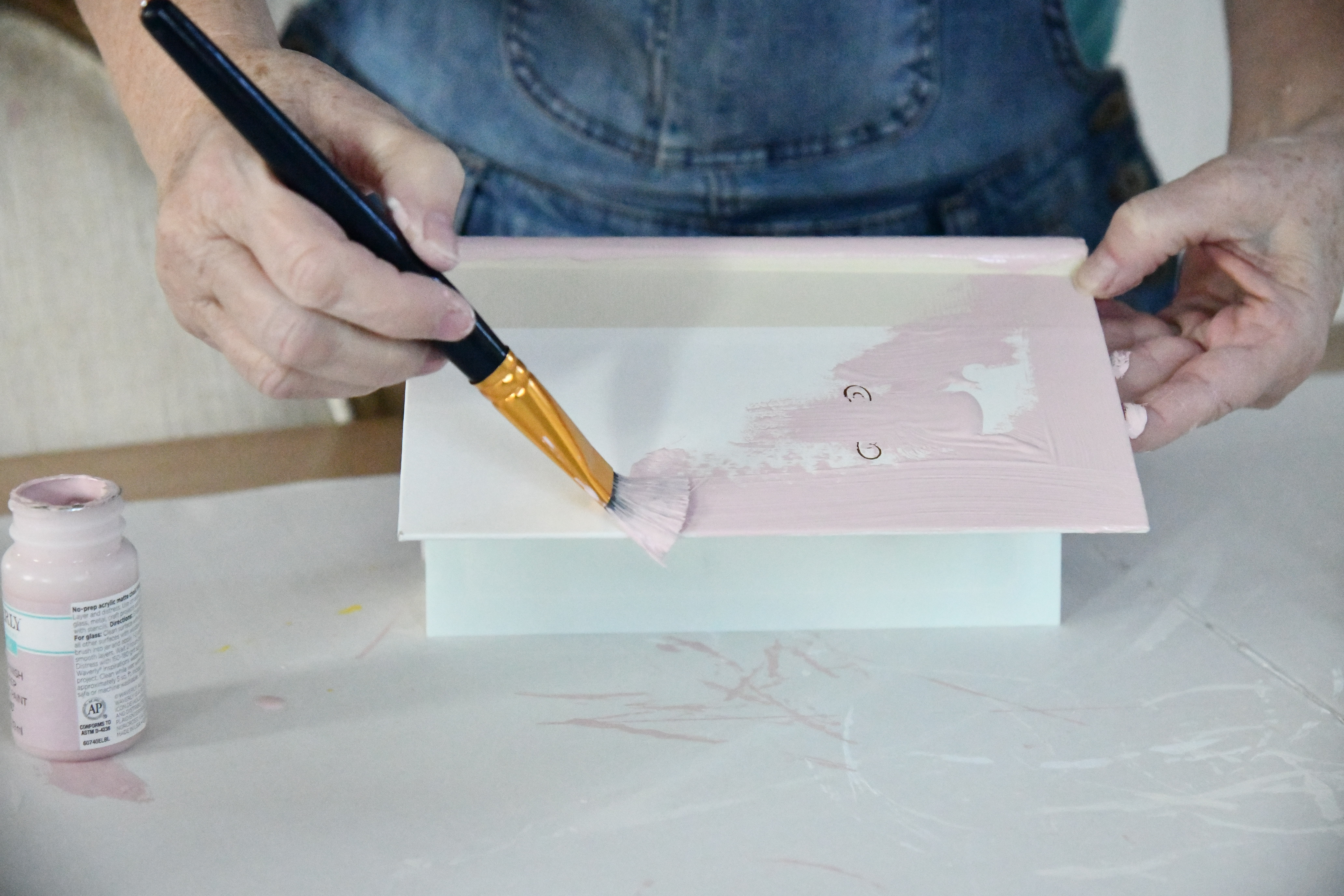 painting a book pink for valentines day DIY decor