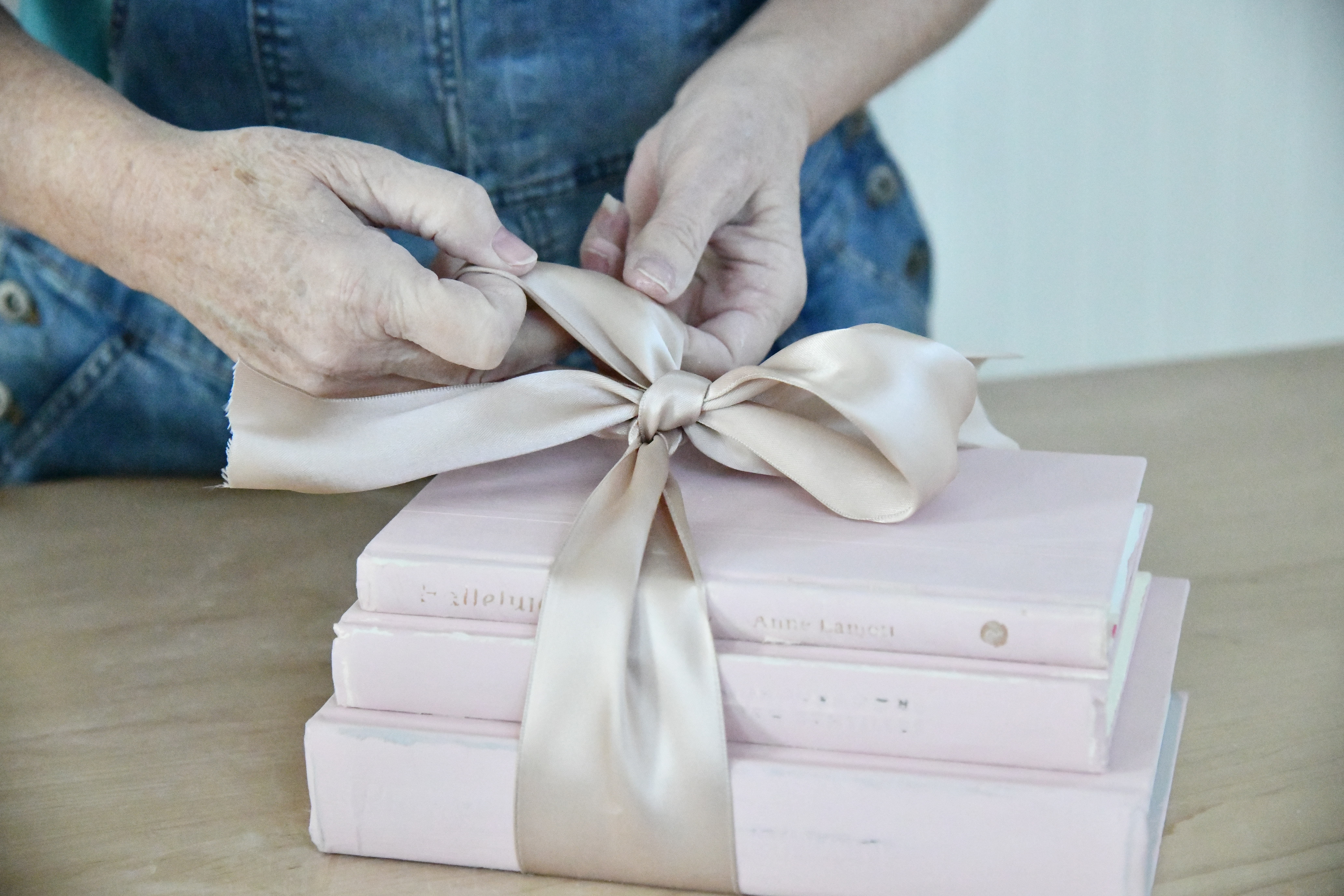 How To DIY Beautiful Farmhouse Books in 4 Steps tie ribbon