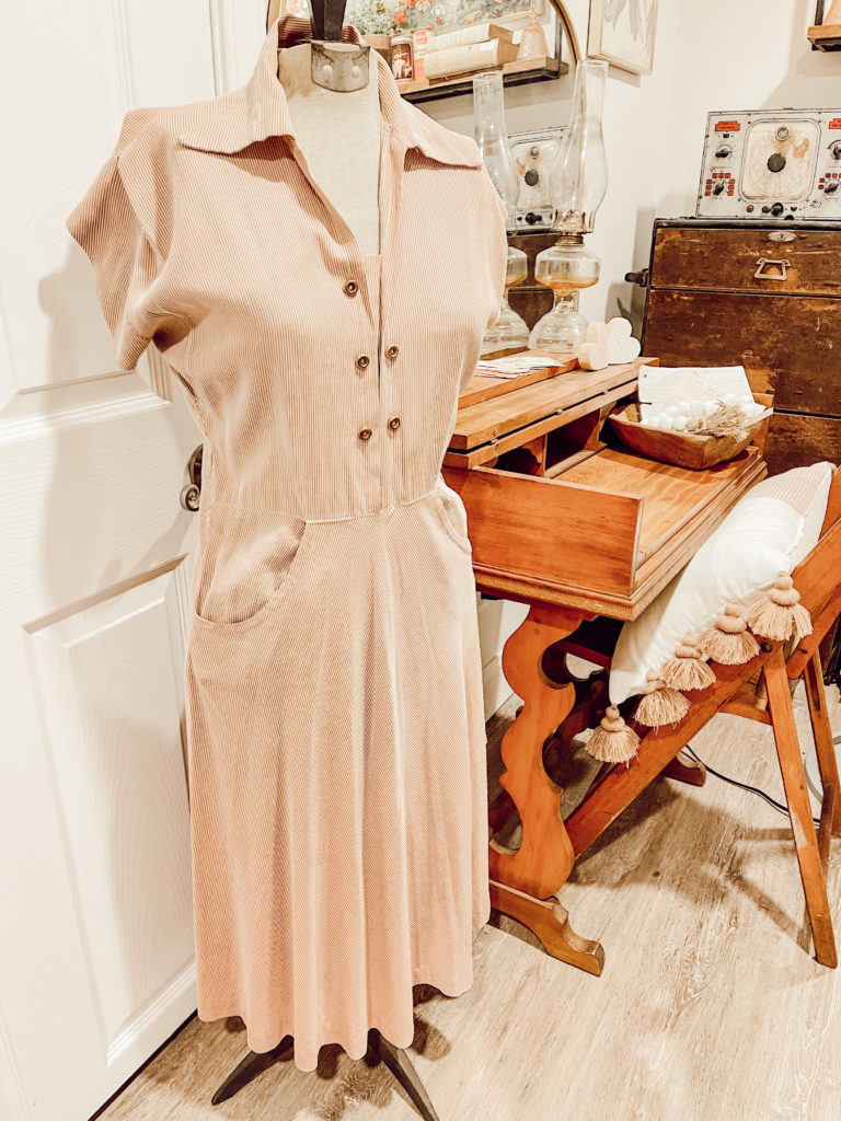 vintage blush dress on vintage mannequin and vintage desk