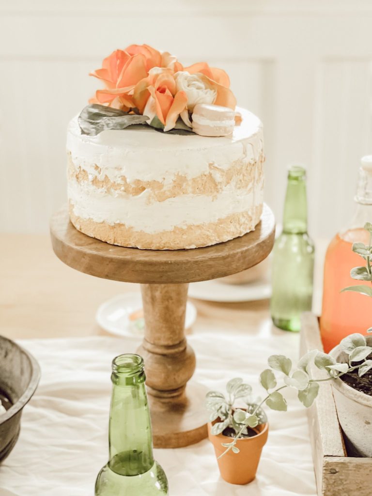 If You Love Peaches You Will Love this Tablescape faux peach cake on wood cake stand