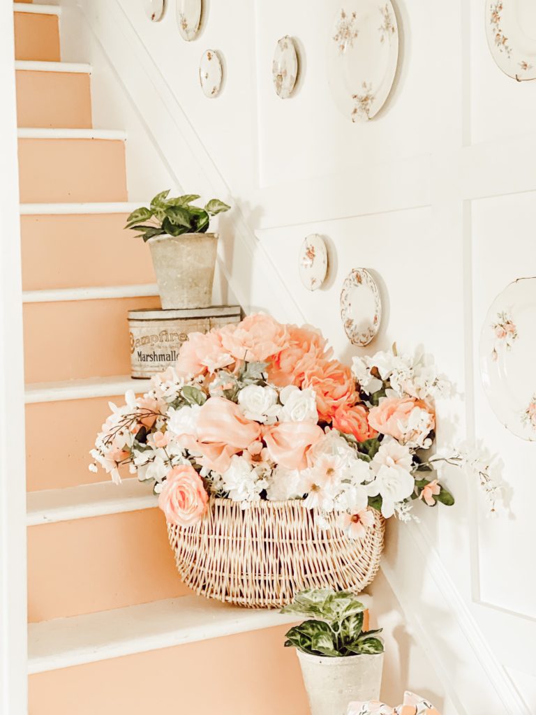 closeup of peach decor and painteed stairs