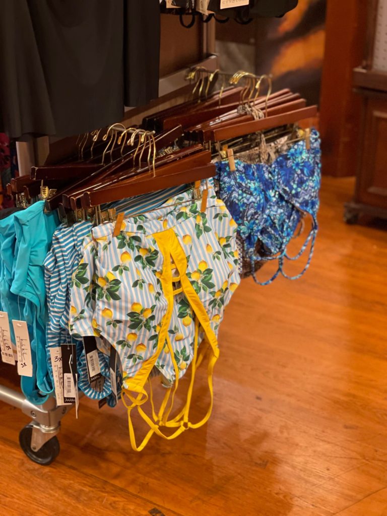 bathing suit hanging on shelf in mercantile store