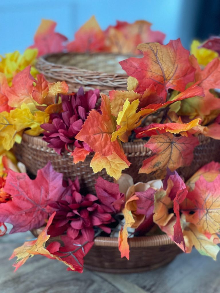 Fall DIY Centerpiece Project tier 2 filled with florals and leaves