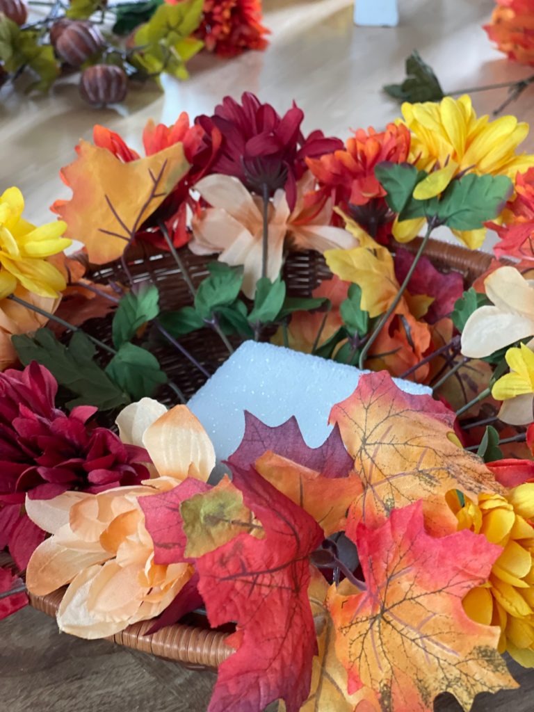Fall DIY Centerpiece Project tier 1 filled with florals and leaves