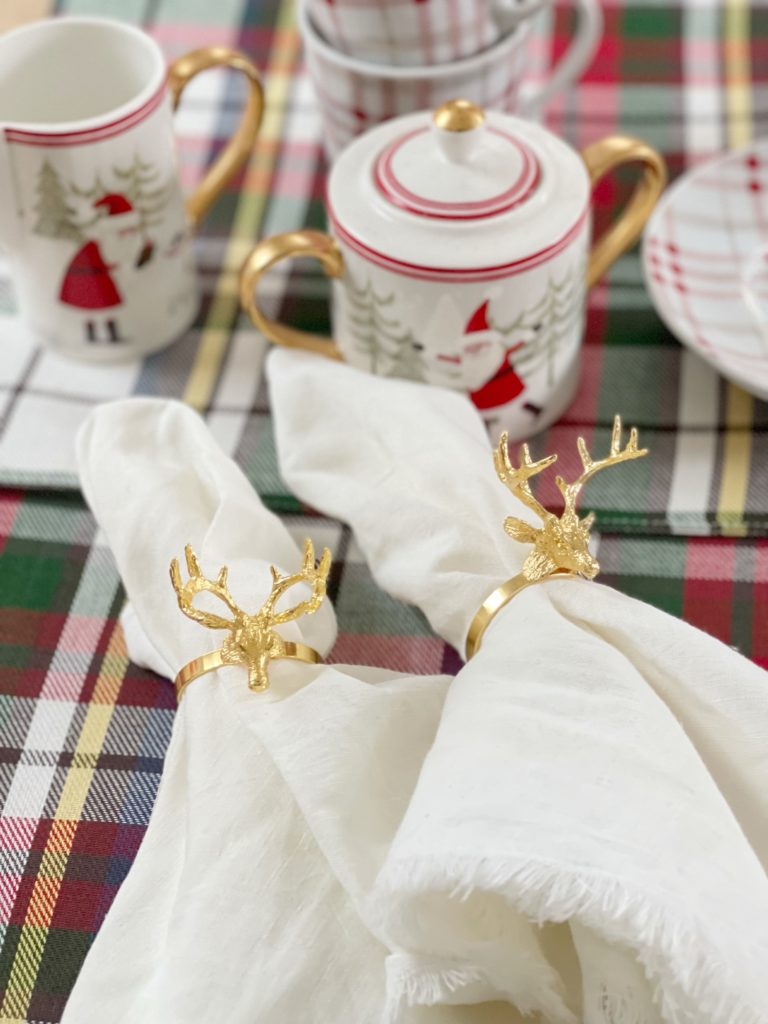 gold deer napkin rings on Christmas plate