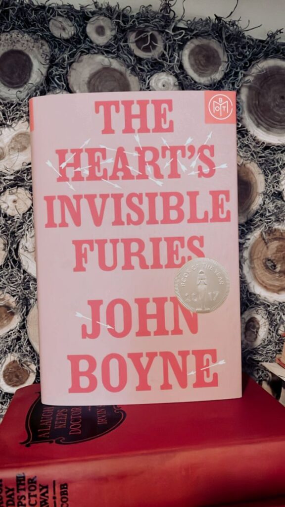 The Hearts Invisible Furies by John Boyne on a mantel
