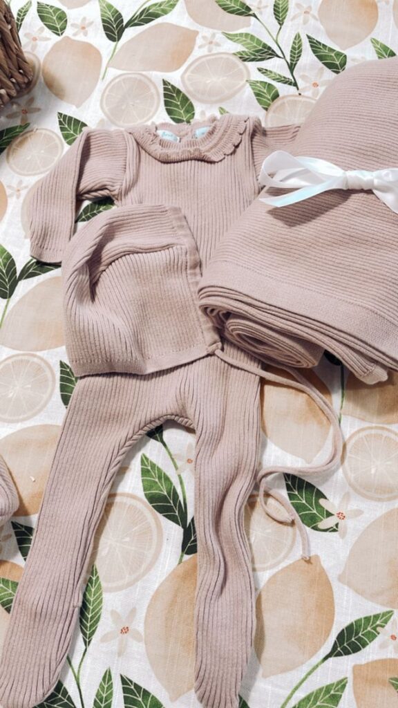 Curious About the Latest Trends in Baby Shower Gifting? Ribbed Baby knit gift set laid out